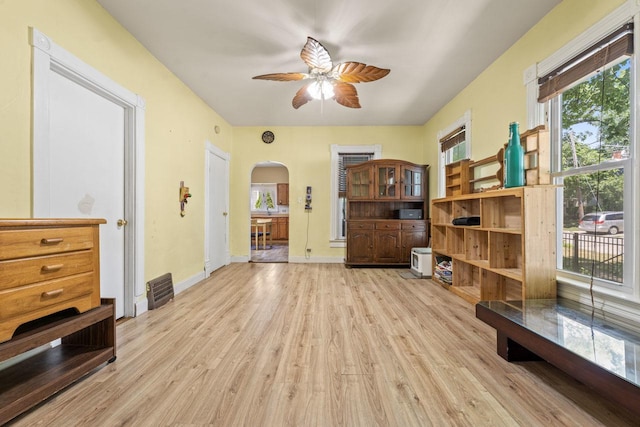 952 Larkin Ave, Elgin, IL 60123 - sitting room featuring arched walkways, a ceiling fan, and light wood-style flooring