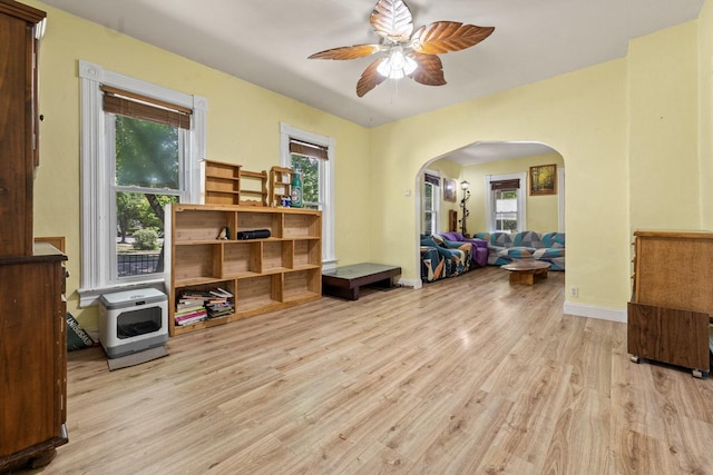 952 Larkin Ave, Elgin, IL 60123 - home office with arched walkways, a ceiling fan, wood finished floors, and plenty of natural light