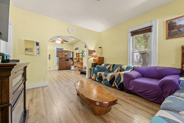 952 Larkin Ave, Elgin, IL 60123 - living area featuring light wood-type flooring, arched walkways, and ceiling fan