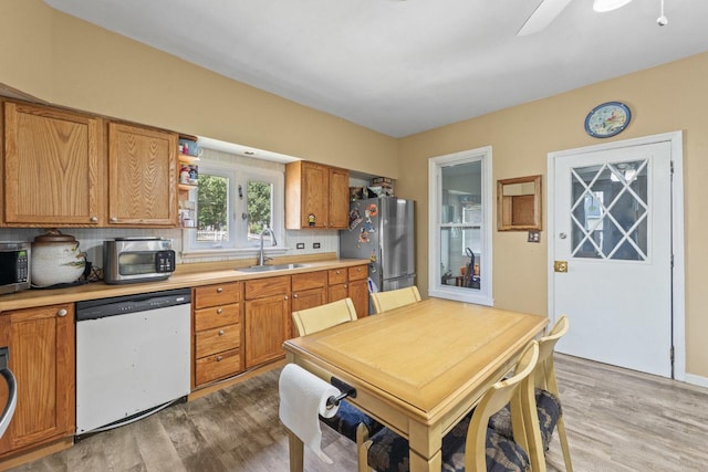 952 Larkin Ave, Elgin, IL 60123 - kitchen with stainless steel appliances, light wood-style floors, and light countertops