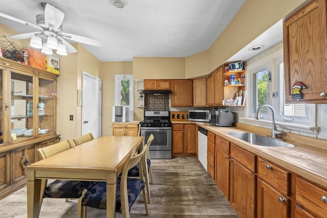 952 Larkin Ave, Elgin, IL 60123 - kitchen with appliances with stainless steel finishes, open shelves, wood finished floors, brown cabinets, and a ceiling fan