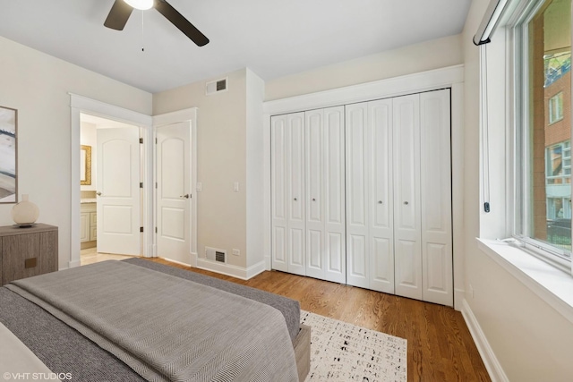 23 N Racine Ave Unit 405, Chicago, IL 60607 - bedroom featuring wood finished floors, multiple windows, and a closet