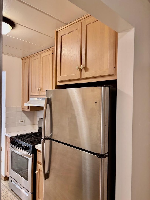 1015 Deerfield Rd Unit 132, Deerfield, IL 60015 - kitchen featuring appliances with stainless steel finishes, light brown cabinets, under cabinet range hood, decorative backsplash, and light countertops