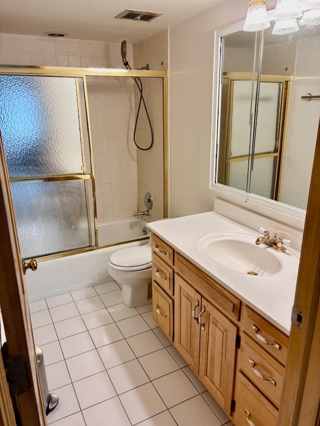 1015 Deerfield Rd Unit 132, Deerfield, IL 60015 - bathroom with vanity, shower / bath combination with glass door, and tile patterned floors