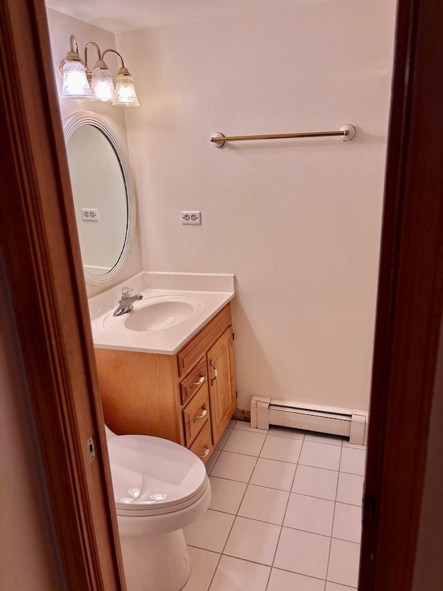 1015 Deerfield Rd Unit 132, Deerfield, IL 60015 - bathroom with a baseboard radiator, vanity, and tile patterned flooring