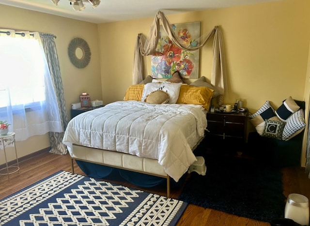 bedroom with wood finished floors