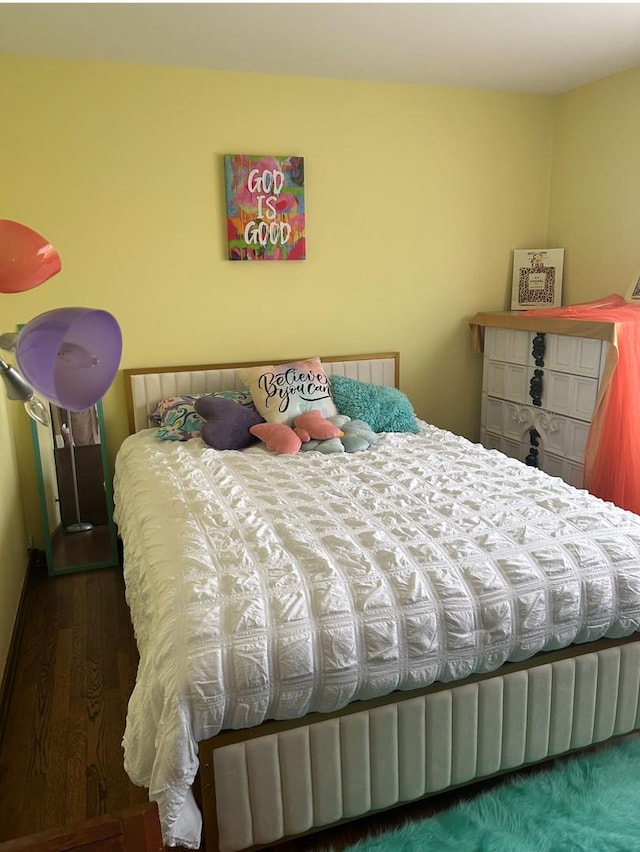 bedroom with wood finished floors