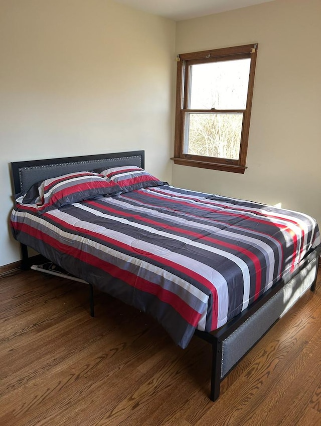 bedroom featuring wood finished floors