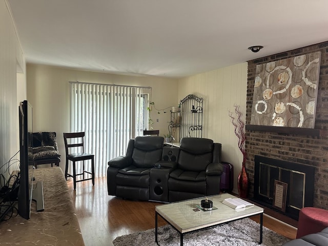 living area with wood finished floors and a fireplace