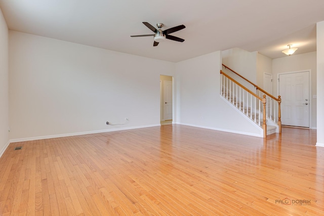 3452 Birch Ln, Naperville, IL 60564 - unfurnished living room featuring stairway, light wood-type flooring, ceiling fan, and baseboards
