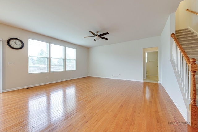 3452 Birch Ln, Naperville, IL 60564 - unfurnished living room with a ceiling fan, stairway, light wood finished floors, and baseboards