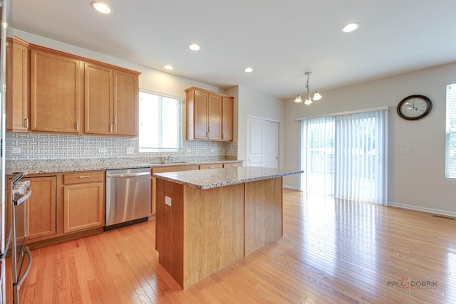 3452 Birch Ln, Naperville, IL 60564 - kitchen featuring stainless steel appliances, backsplash, a chandelier, healthy amount of natural light, and recessed lighting