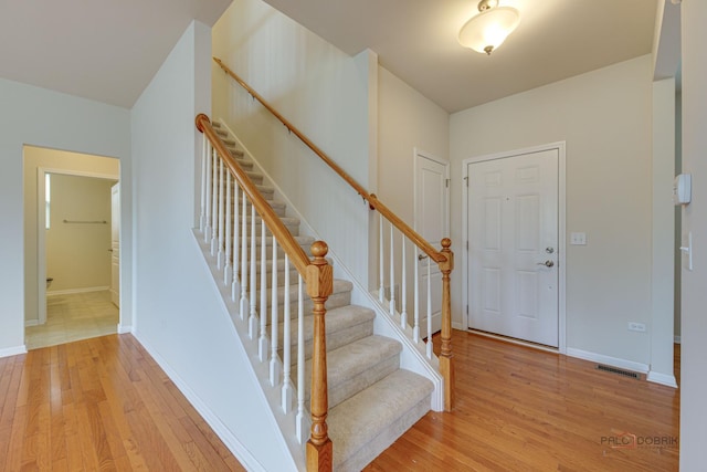 3452 Birch Ln, Naperville, IL 60564 - entryway featuring light wood-style flooring, baseboards, and stairway