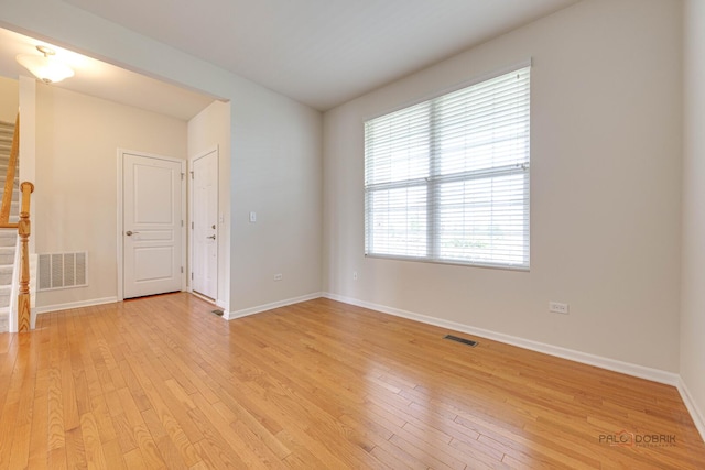 3452 Birch Ln, Naperville, IL 60564 - empty room with light wood-style floors, baseboards, and stairs