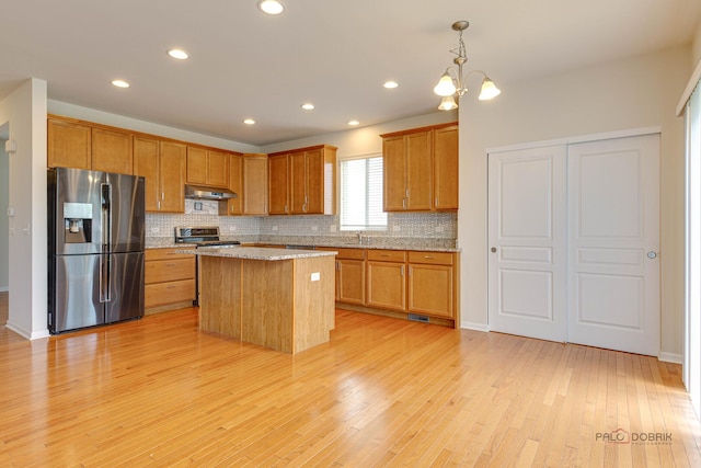 3452 Birch Ln, Naperville, IL 60564 - kitchen with appliances with stainless steel finishes, under cabinet range hood, tasteful backsplash, light wood-style flooring, and recessed lighting