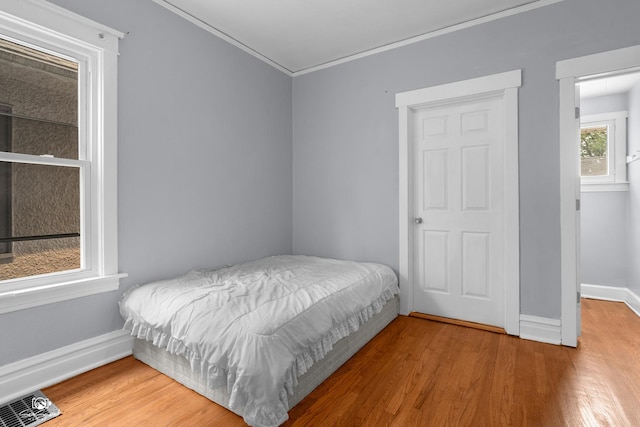 5719 S Spaulding Ave, Chicago, IL 60629 - bedroom with ornamental molding, wood finished floors, and baseboards