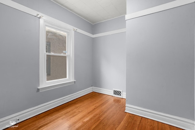 5719 S Spaulding Ave, Chicago, IL 60629 - spare room featuring wood finished floors, baseboards, and ornamental molding