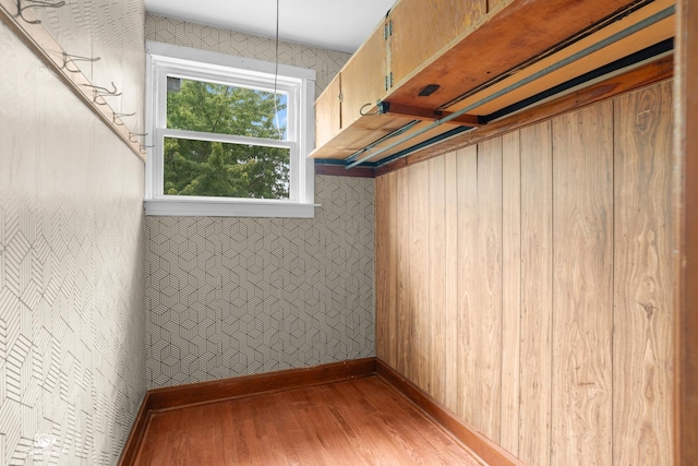 5719 S Spaulding Ave, Chicago, IL 60629 - basement featuring light wood-style floors, baseboards, and wallpapered walls