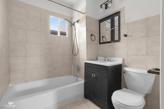 5719 S Spaulding Ave, Chicago, IL 60629 - bathroom with tile walls, toilet, vanity, tub / shower combination, and tile patterned flooring