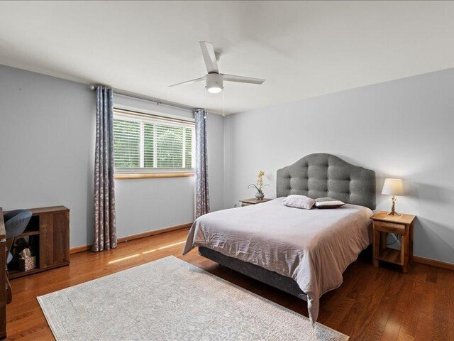 14542 S Mustang Dr, Homer Glen, IL 60491 - bedroom featuring multiple windows, light wood-style floors, and ceiling fan