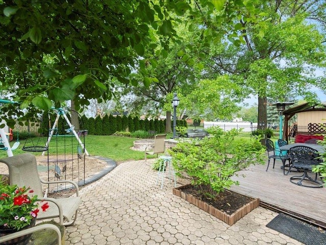 14542 S Mustang Dr, Homer Glen, IL 60491 - fenced backyard with outdoor dining area, a wooden deck, and a patio