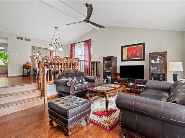 14542 S Mustang Dr, Homer Glen, IL 60491 - living area featuring wood-type flooring, healthy amount of natural light, vaulted ceiling, and a ceiling fan