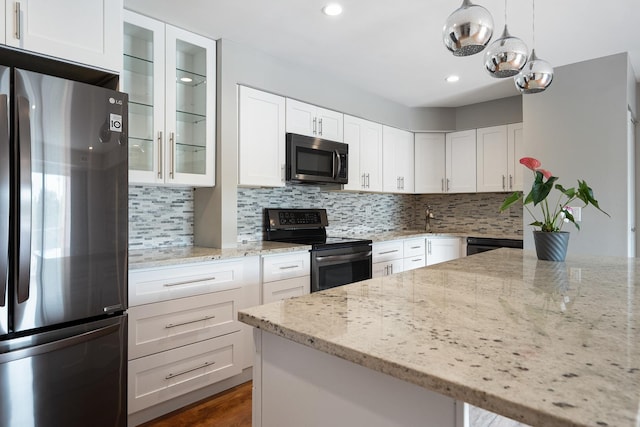 810 N River Rd Unit 3A, Mount Prospect, IL 60056 - kitchen with appliances with stainless steel finishes, glass insert cabinets, white cabinetry, backsplash, and recessed lighting