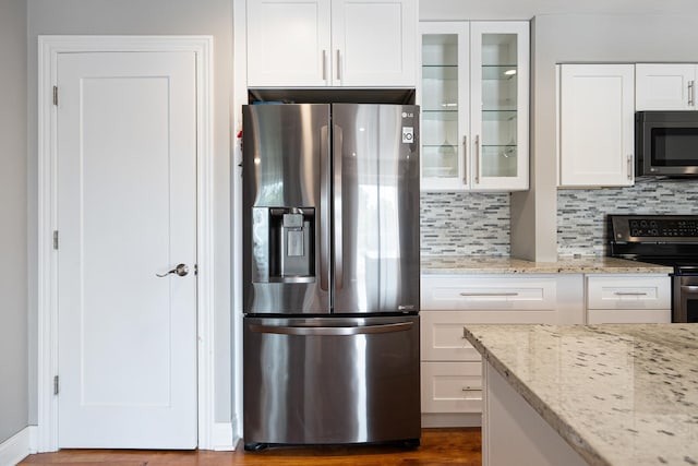 810 N River Rd Unit 3A, Mount Prospect, IL 60056 - kitchen with stainless steel appliances, glass insert cabinets, and white cabinetry