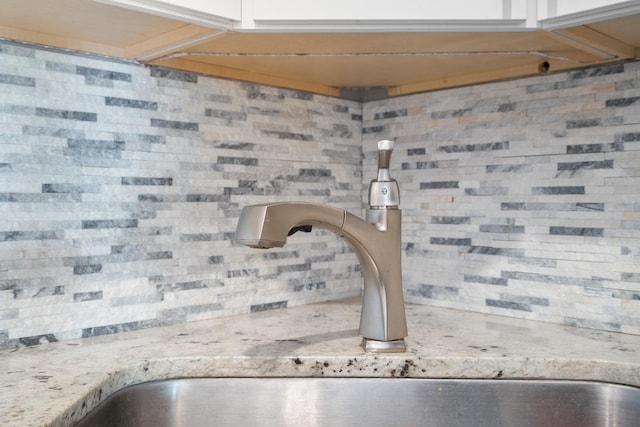 810 N River Rd Unit 3A, Mount Prospect, IL 60056 - kitchen view of a sink, tasteful backsplash, and light stone countertops