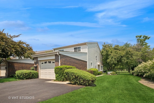 30 W Wimbolton Dr Unit 30, Mount Prospect, IL 60056 - view of front of home featuring a garage, a front lawn, brick siding, and driveway