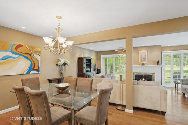 30 W Wimbolton Dr Unit 30, Mount Prospect, IL 60056 - dining space featuring a chandelier, light wood-style floors, plenty of natural light, recessed lighting, and a fireplace