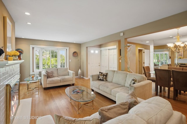 30 W Wimbolton Dr Unit 30, Mount Prospect, IL 60056 - living area with light wood finished floors, a chandelier, recessed lighting, and a fireplace