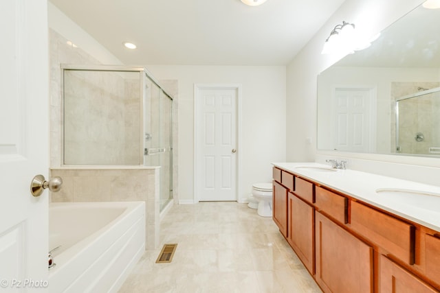336 Sype Dr, Carol Stream, IL 60188 - bathroom with a bath, double vanity, a stall shower, toilet, and recessed lighting