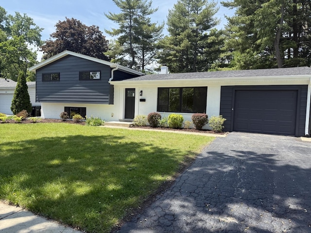 222 S Maple St, Palatine, IL 60067 - split level home featuring an attached garage, a front yard, a chimney, and driveway