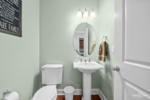 3880 W Nettle Creek Dr, Morris, IL 60450 - bathroom with toilet, wood finished floors, baseboards, and a sink