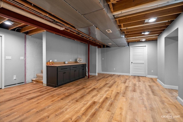 3880 W Nettle Creek Dr, Morris, IL 60450 - finished basement with light wood-type flooring, stairs, and baseboards