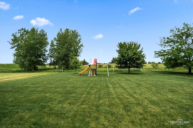3880 W Nettle Creek Dr, Morris, IL 60450 - view of green lawn with a playground