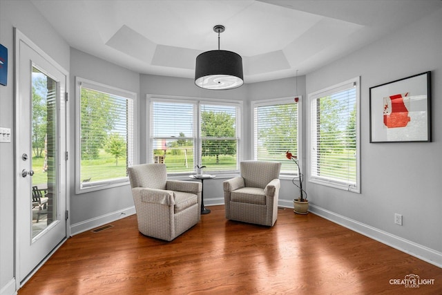 3880 W Nettle Creek Dr, Morris, IL 60450 - sitting room with a tray ceiling, wood finished floors, and baseboards