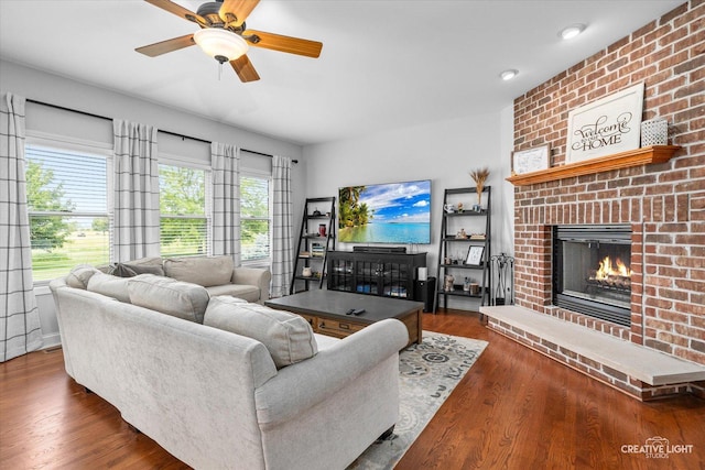 3880 W Nettle Creek Dr, Morris, IL 60450 - living room featuring a fireplace, ceiling fan, and wood finished floors
