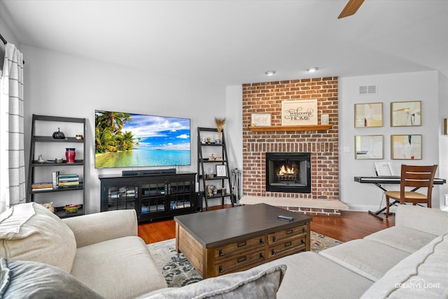 3880 W Nettle Creek Dr, Morris, IL 60450 - living area with wood finished floors, a fireplace, a ceiling fan, and recessed lighting