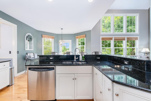 769 Brighton Dr, Sugar Grove, IL 60554 - kitchen with dishwasher, a sink, white cabinets, dark stone counters, and light wood-style floors