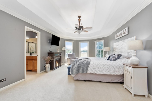 769 Brighton Dr, Sugar Grove, IL 60554 - bedroom with light colored carpet, ornamental molding, a tray ceiling, ensuite bath, and baseboards