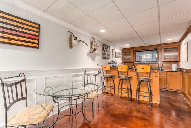 769 Brighton Dr, Sugar Grove, IL 60554 - dining room with ornamental molding, finished concrete floors, recessed lighting, and a wainscoted wall
