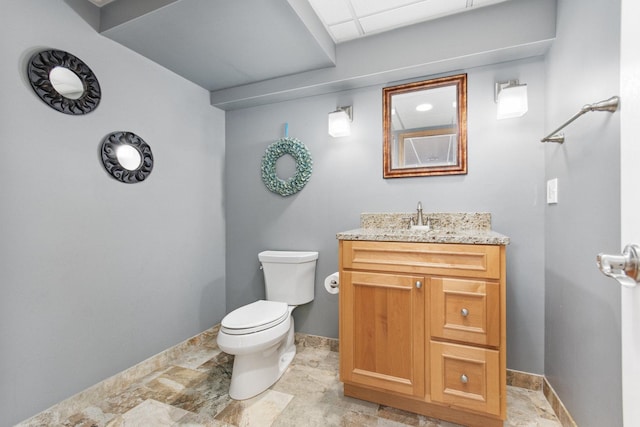 769 Brighton Dr, Sugar Grove, IL 60554 - half bathroom featuring toilet, vanity, baseboards, and stone finish flooring