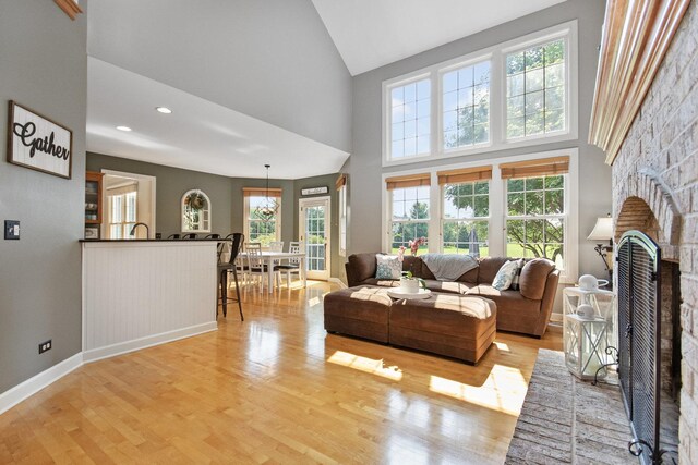 769 Brighton Dr, Sugar Grove, IL 60554 - living area with high vaulted ceiling, wood finished floors, and a ceiling fan