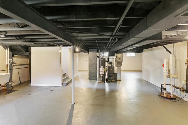 482 Fitch Rd, Chicago Heights, IL 60411 - below grade area with gas water heater, stairs, and heating unit