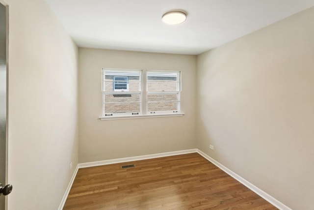 482 Fitch Rd, Chicago Heights, IL 60411 - empty room featuring wood finished floors and baseboards