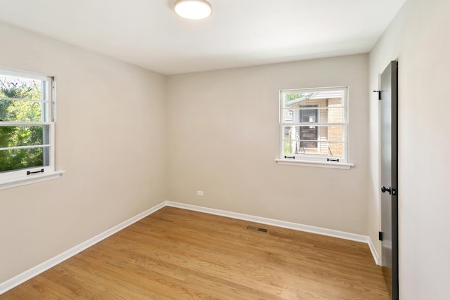 482 Fitch Rd, Chicago Heights, IL 60411 - unfurnished room featuring baseboards and light wood-style flooring