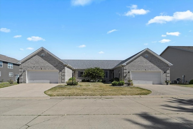 2104A Lucille Ln, Mahomet, IL 61853 - single story home with driveway, a garage, brick siding, and a front lawn