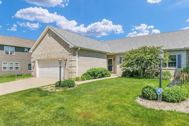 2104A Lucille Ln, Mahomet, IL 61853 - view of front of home with brick siding, concrete driveway, a garage, a front yard, and roof with shingles